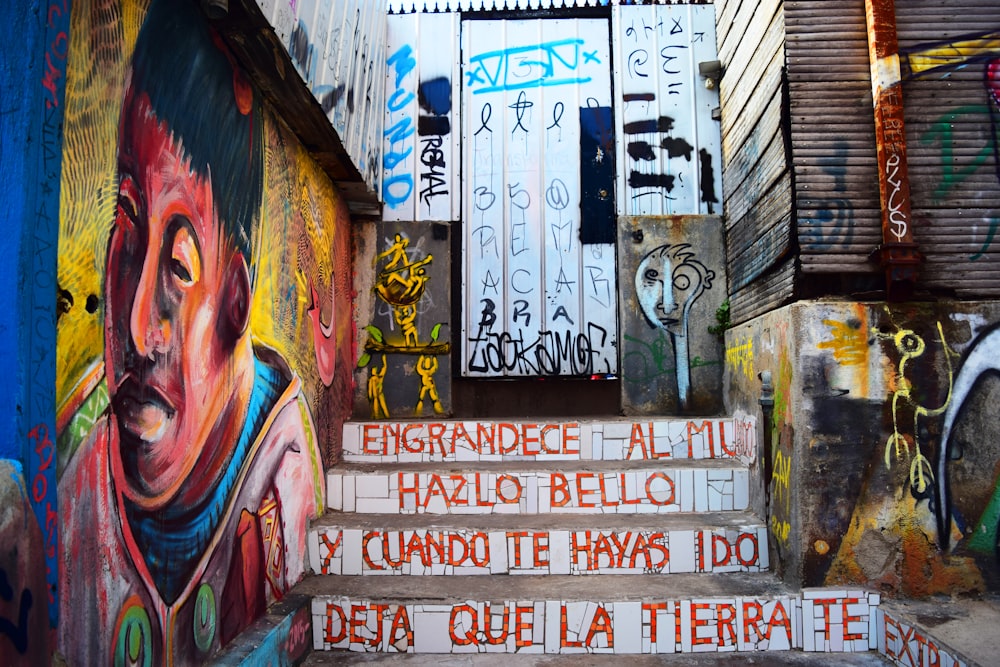 stairs near door and wall with graffiti