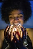 woman holding white string lights