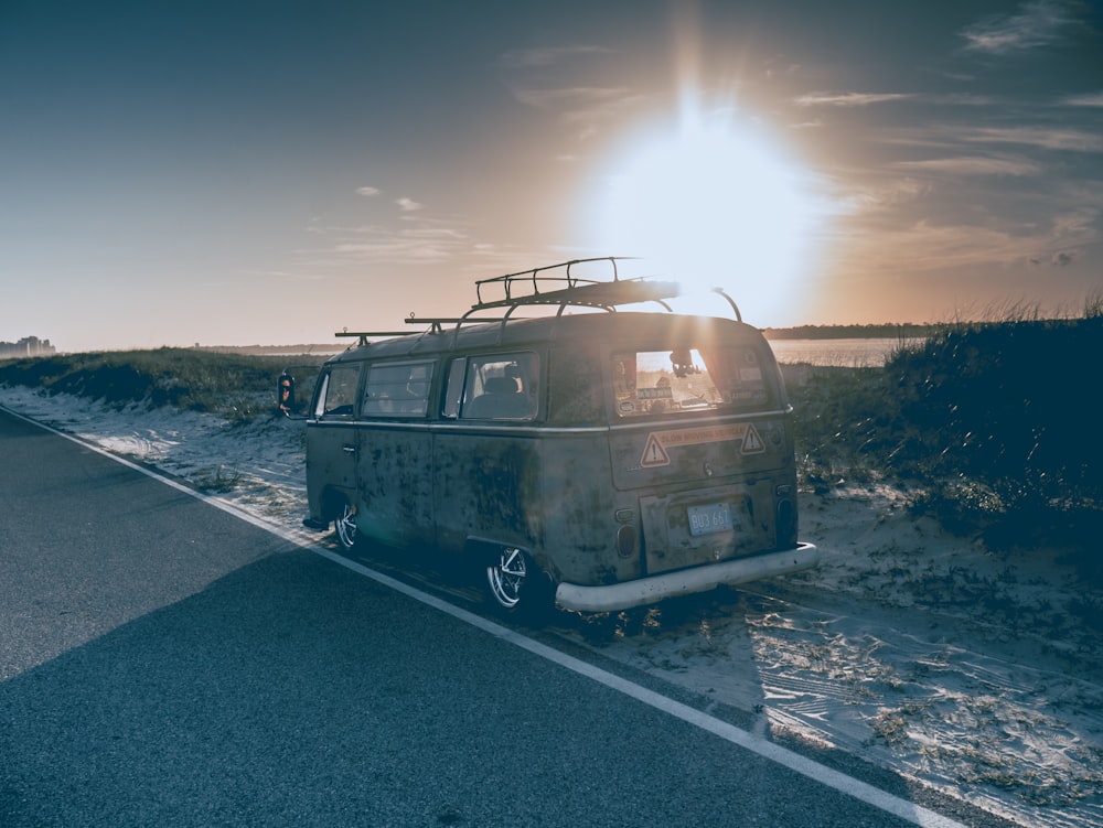 gray van parked beside road during daytime