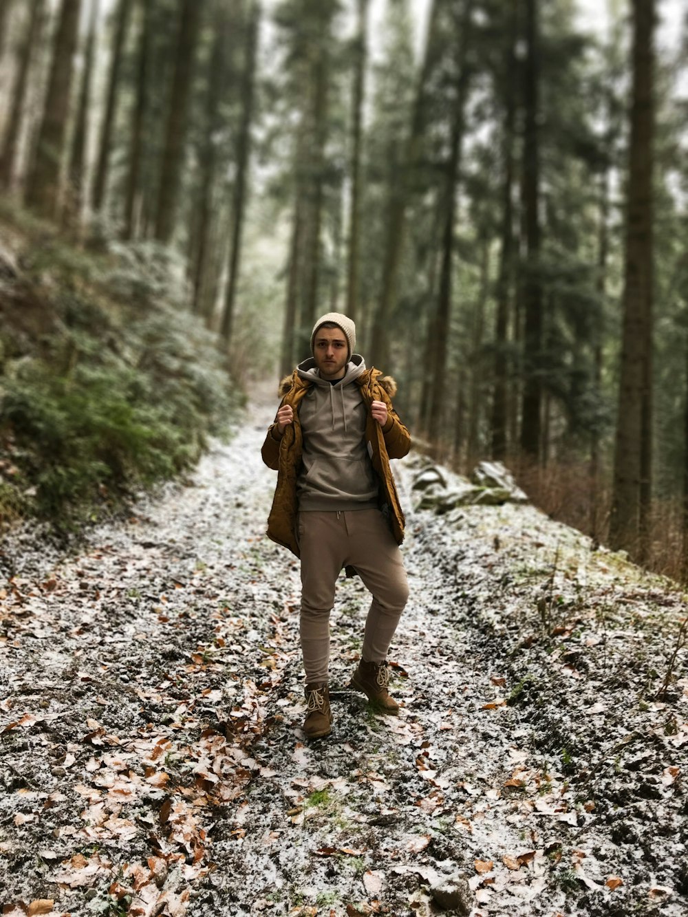 selective focus photography of man on forest