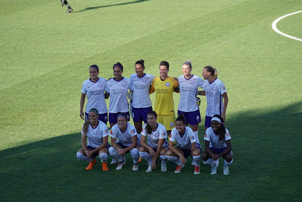 female soccer players taking photo