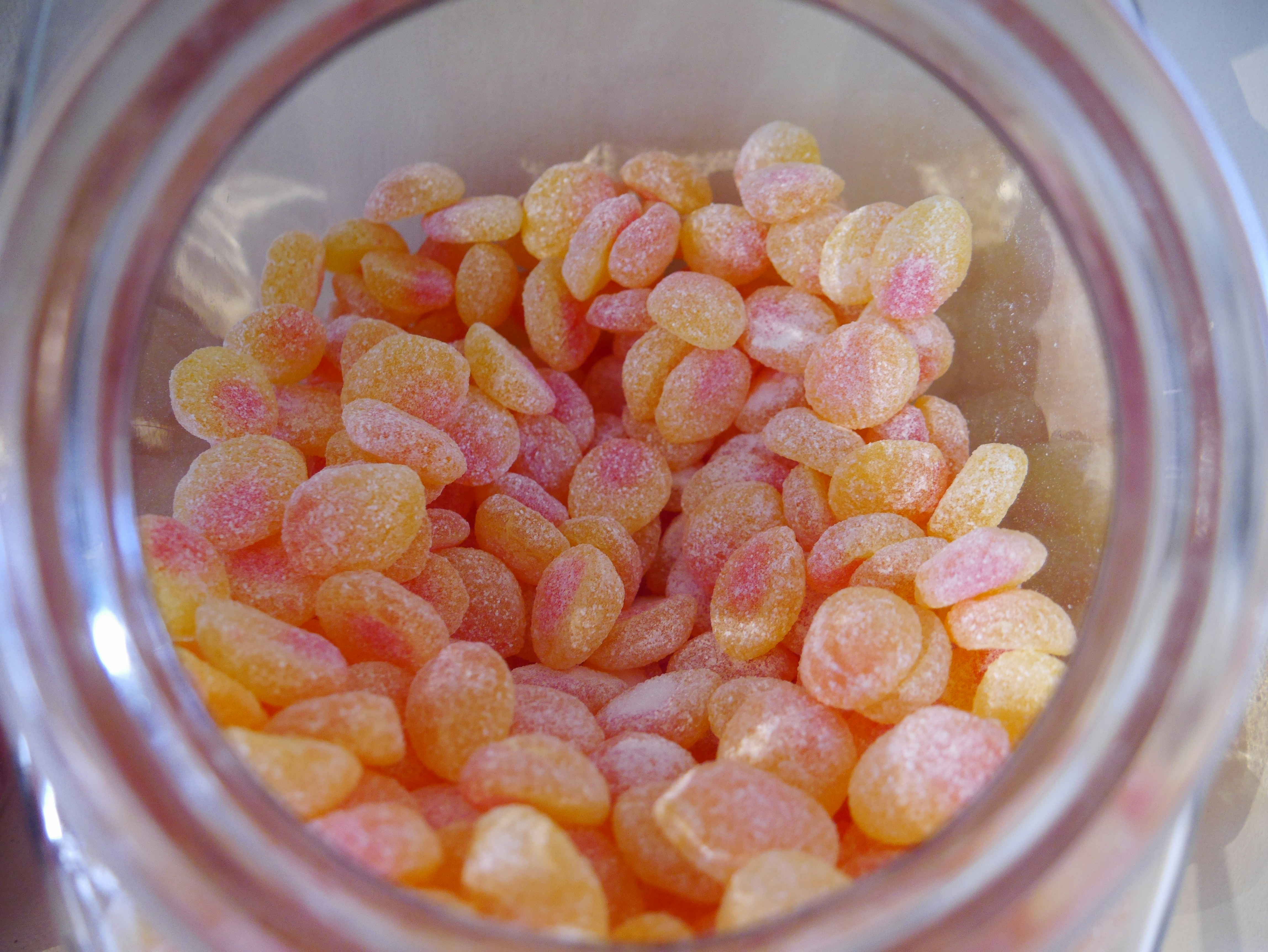 Pink beauty gummies in elegant glass jar with gold lid
