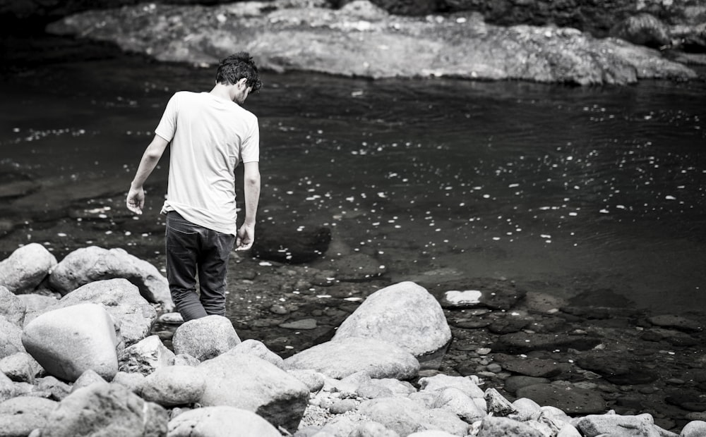 person standing near body of water