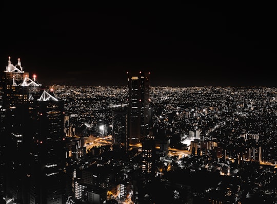 city buildings during night time in Tokyo Metropolitan Government Building observation room Japan