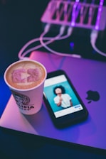 black iphone 5 on pink surface