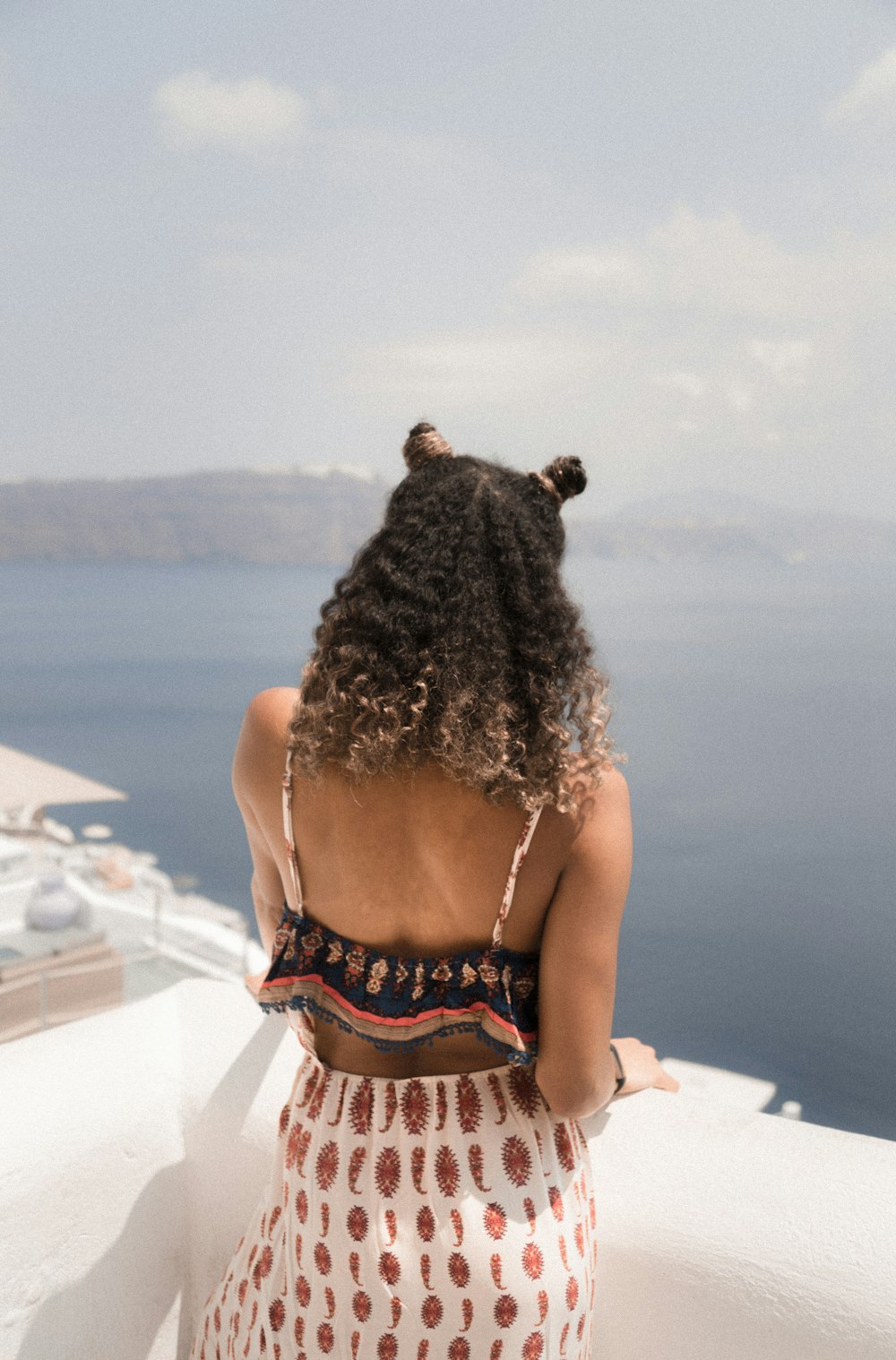 woman standing on balcony