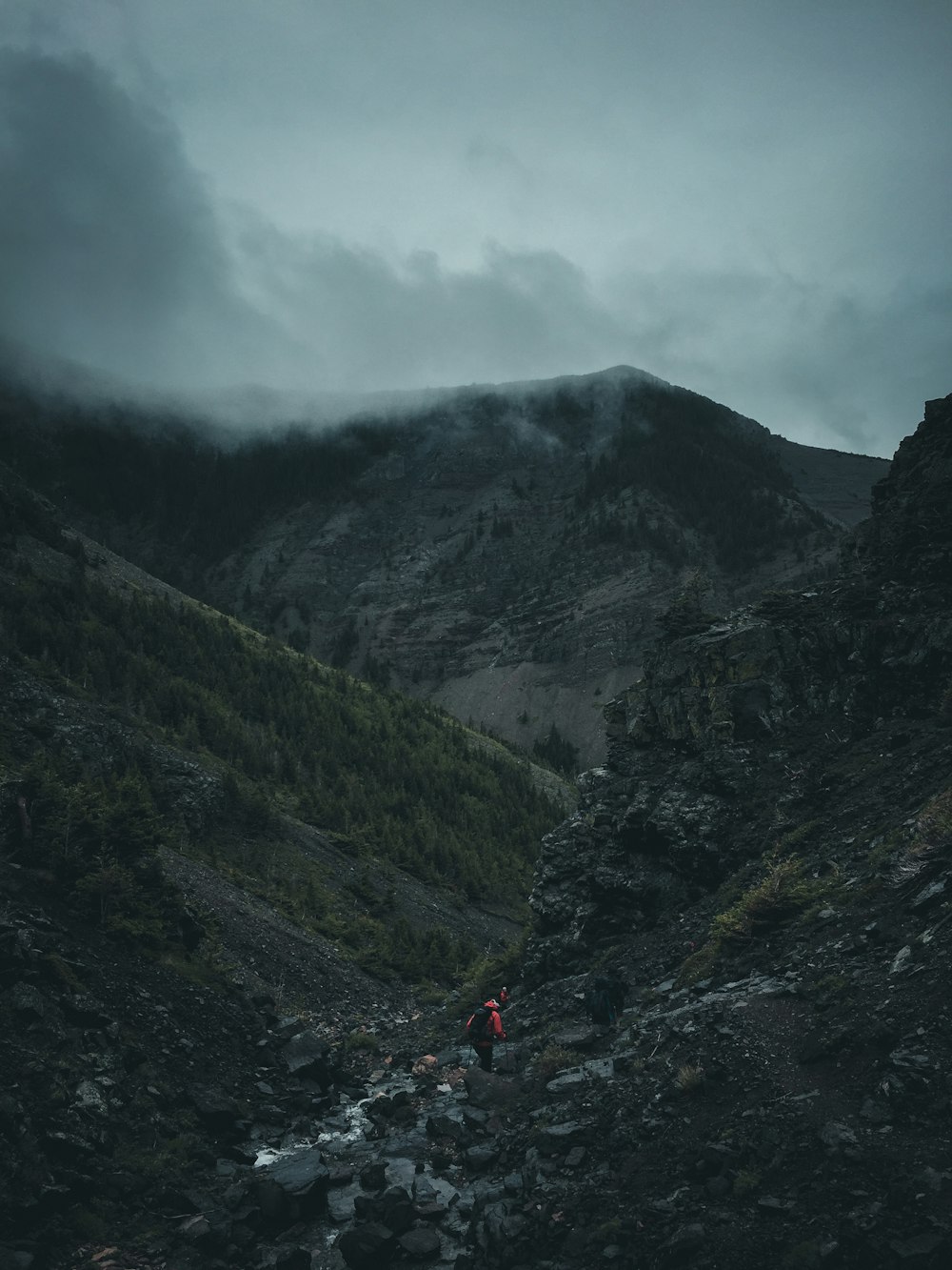 man walking on rocky mountain