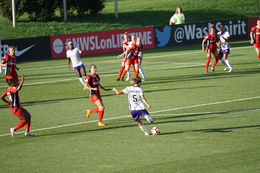 girls playing soccer on ball field