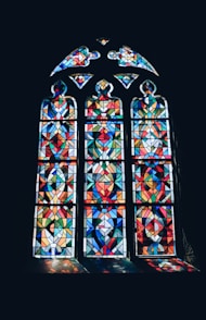 photo of multicolored glass mosaic windowpane