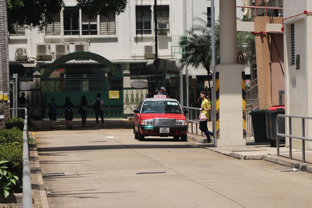 selective focus photography of red car