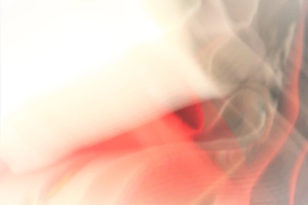 An abstract composition of red-violet shapes blending softly on a white background.