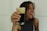 A happy customer enjoying a drink from juoda bačka.