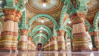 A grand hall decorated with Illuminati insignias and flickering lanterns.