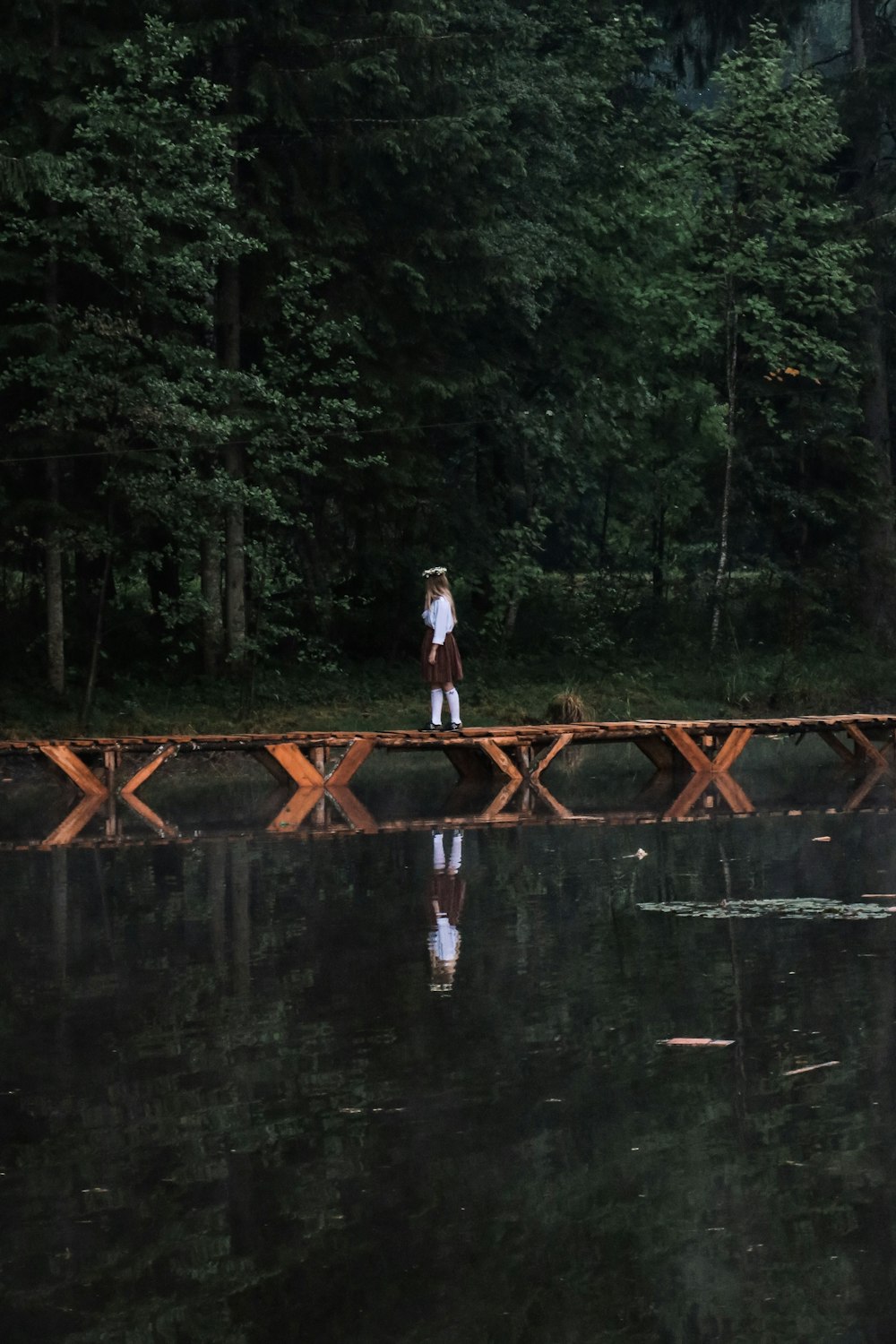 woman crossing on bridge