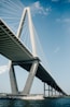 white suspension bridge on water