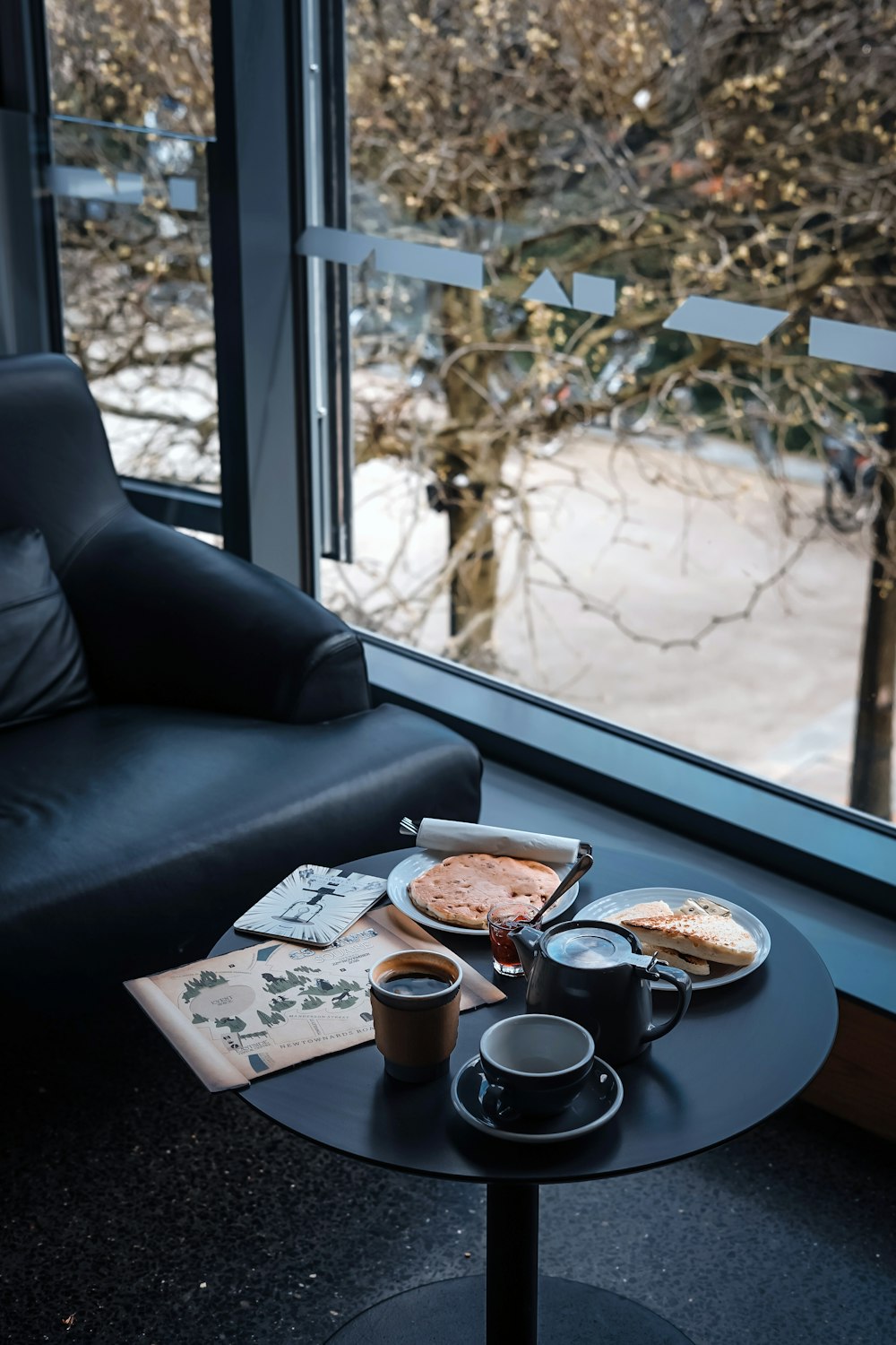 round black side table with coffee cup