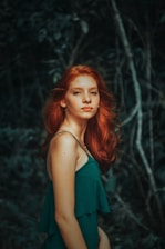 woman wearing teal noodle strap dress