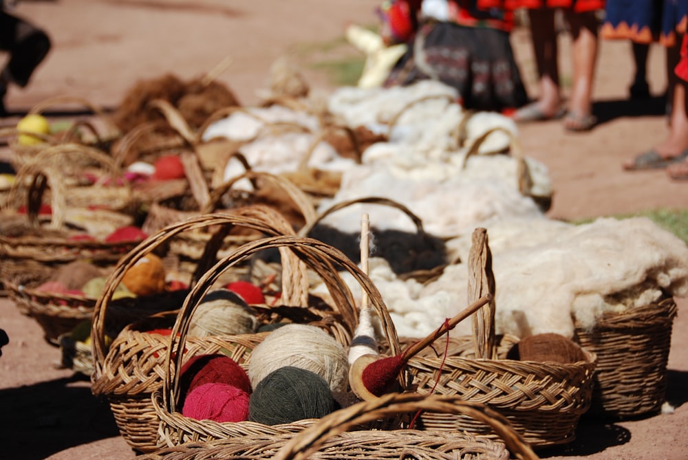 brown wicker baskets pile on ground