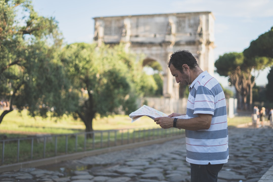 man reading newspaper while standing