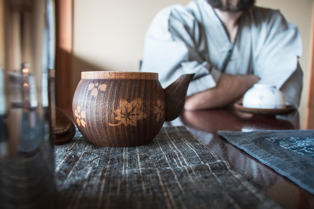 brown and beige floral teapot on tabletop, This picture has been taken in a “ryokan”, a typical Japanese house. We were having a tea, sitting at a”chabudai”, a short-legged table, the room was smelling like tea and we were wearing a comfortable dressing gown.<p></figure>I’ll never stop recommending everyone to spend a day in a ryokan, at least once in a lifetime: I’ve experienced a restoring separation from our frenetic, noisy world, resting as a kid after an afternoon playing.</p><p>It has been like visiting a wonderful, quiet, parallel universe.