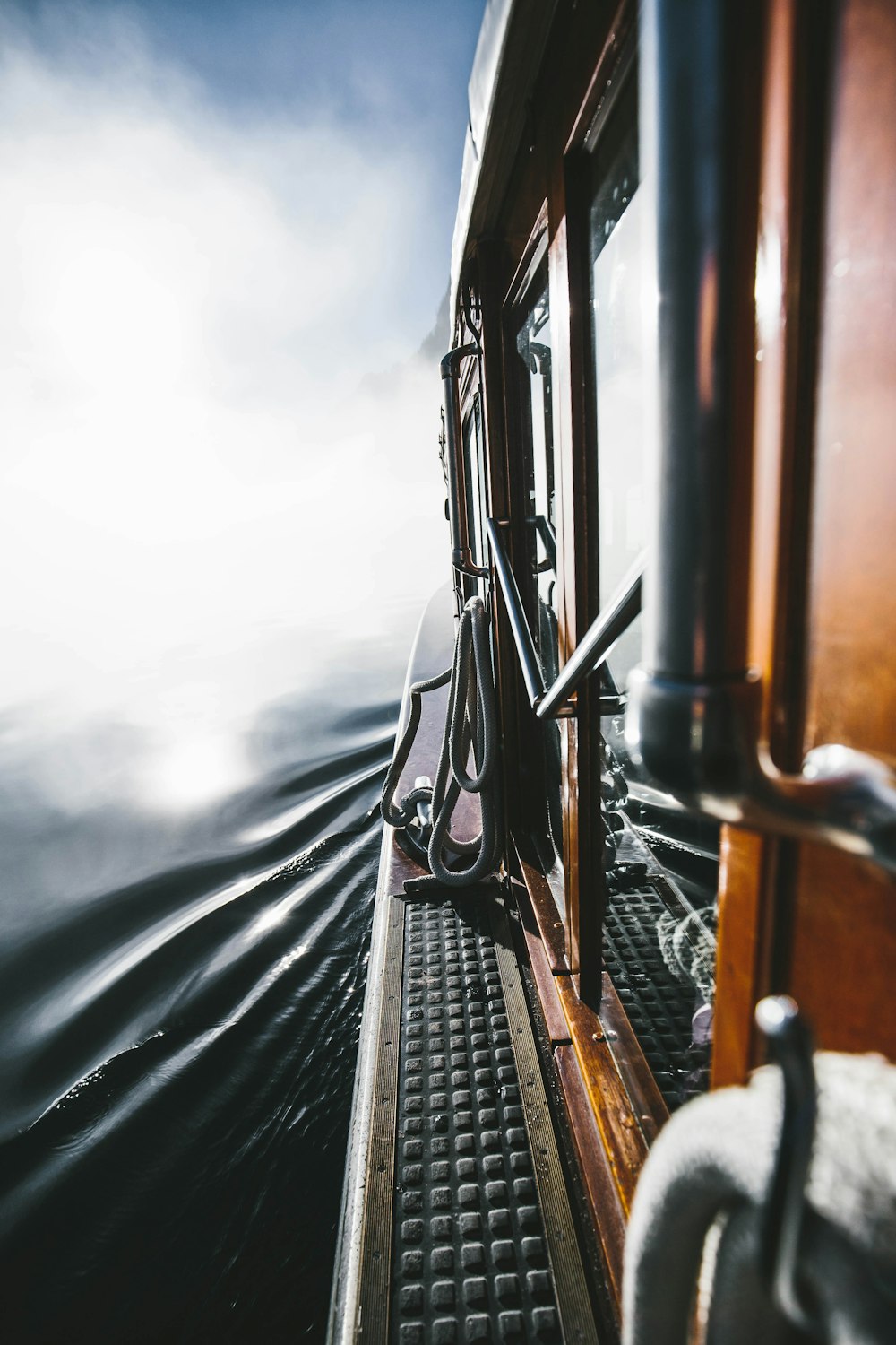 a view from the inside of a boat on the water