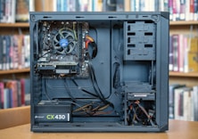 black computer tower on brown wooden table