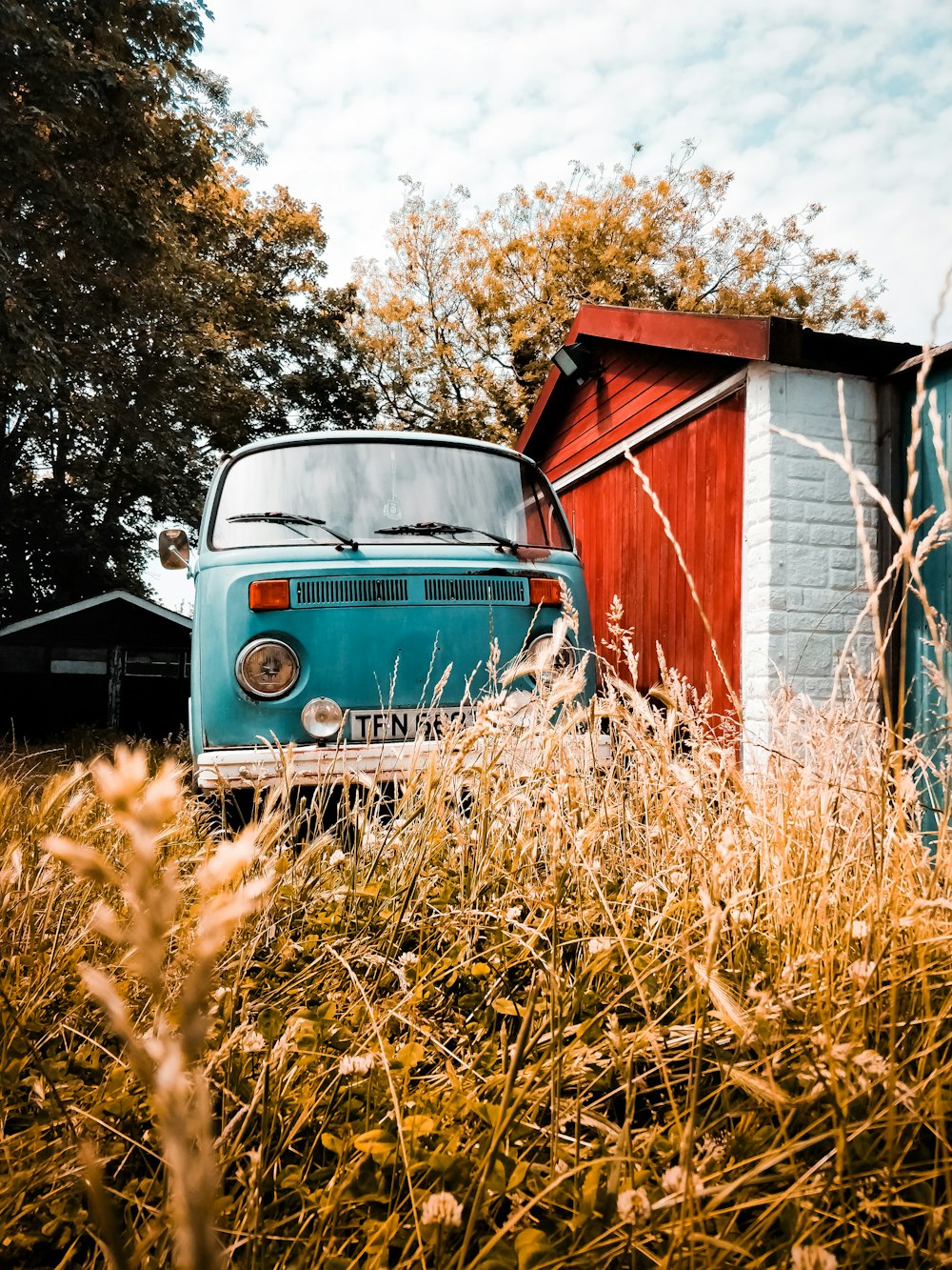 blue Volkswagen T1 parked near house