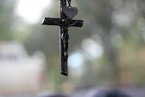 Close-up of a beautifully detailed religious pendant with soft natural lighting.