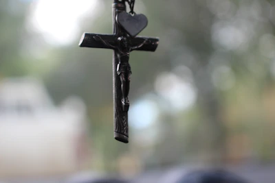 Close-up of a beautifully detailed religious pendant with soft natural lighting.