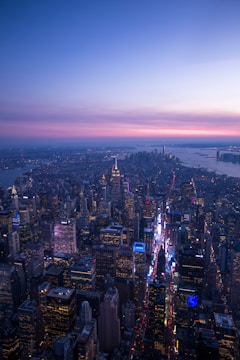 Aerial view of a vibrant city skyline at sunset.
