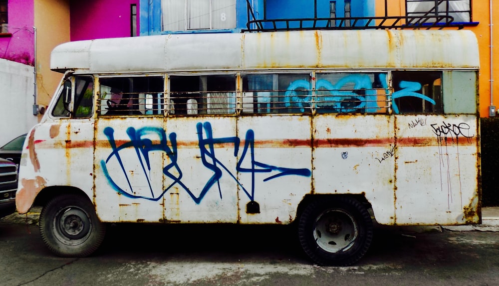 white bus under cloudy sky