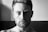 greyscale photo of topless man