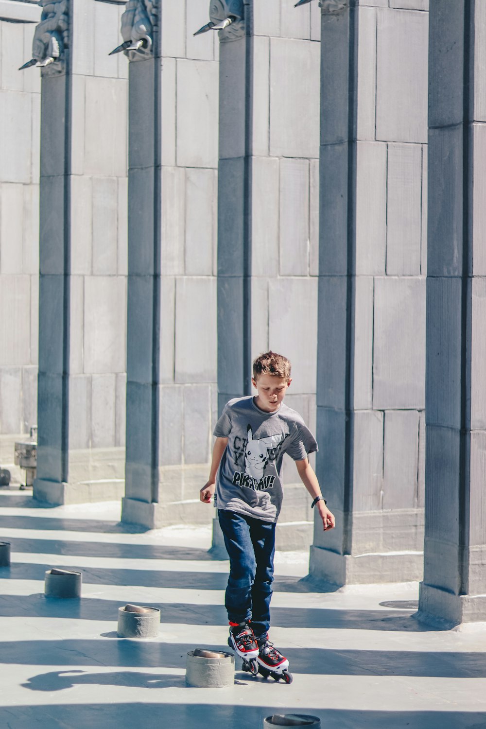 boy using inline skates on hallway