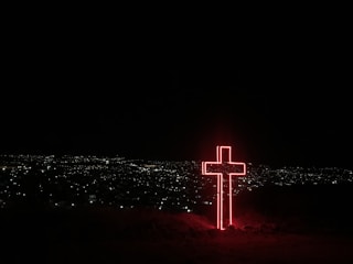 red neon light cross signage