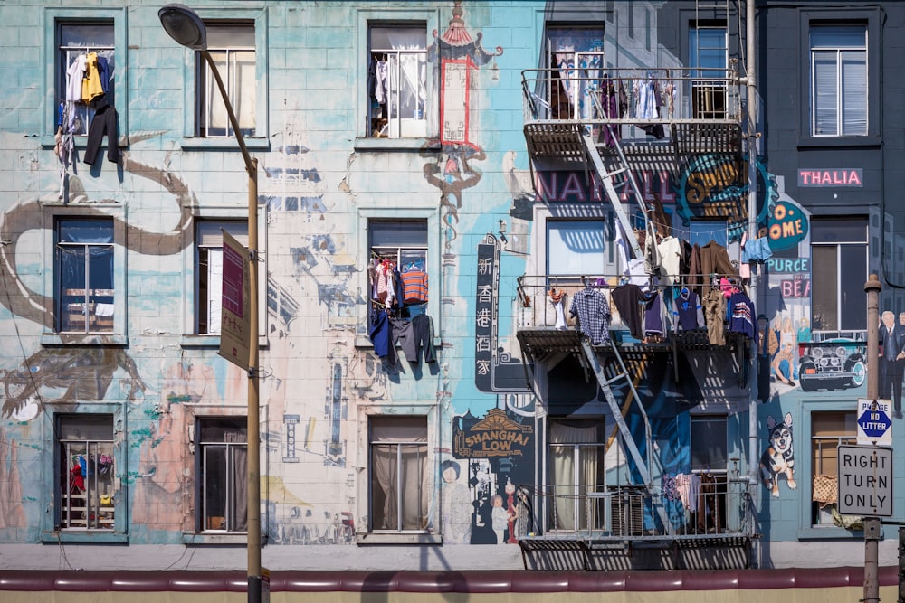 multicolored clothed hanged on terrace rails