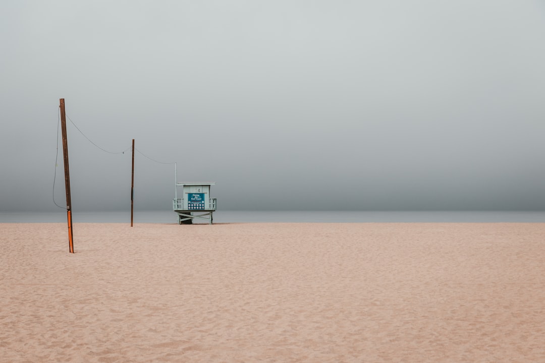 photo of volleyball net on sands