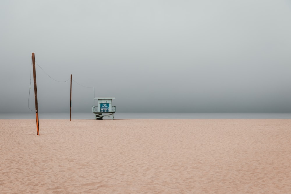 photo of volleyball net on sands