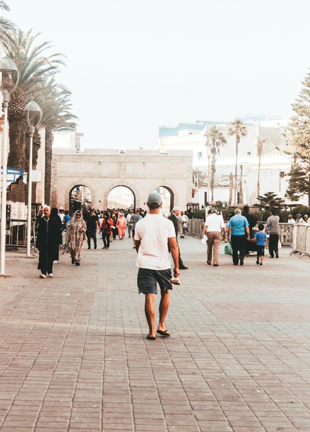 group of people walking on street during daytime