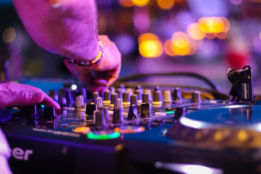 Hands on a turntable at night