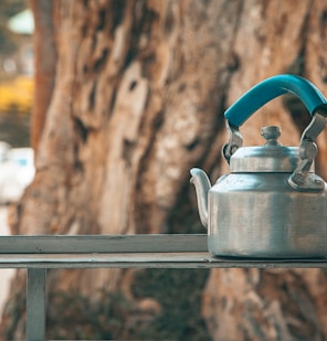 gray kettle on gray metal stand