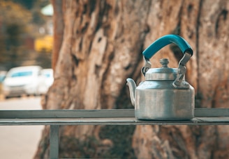 gray kettle on gray metal stand