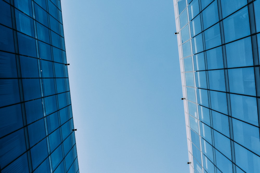 low angle photography of curtain wall building at day time