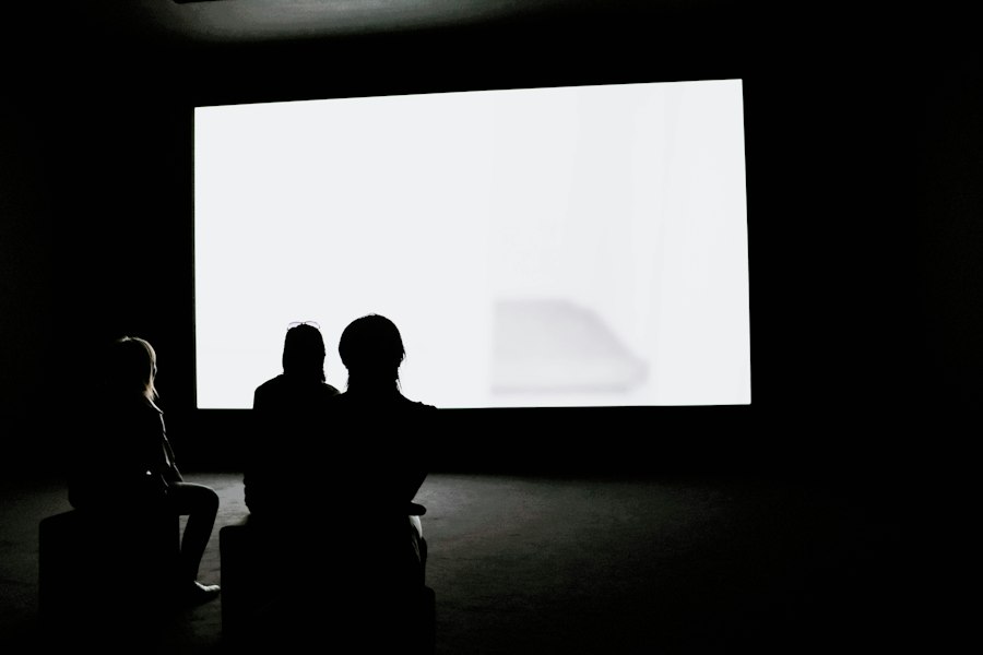 Audience watching a large presentation screen