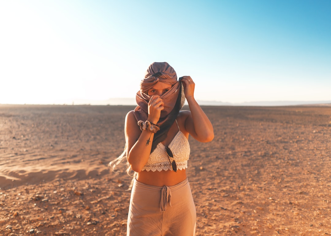 woman standing on desert,