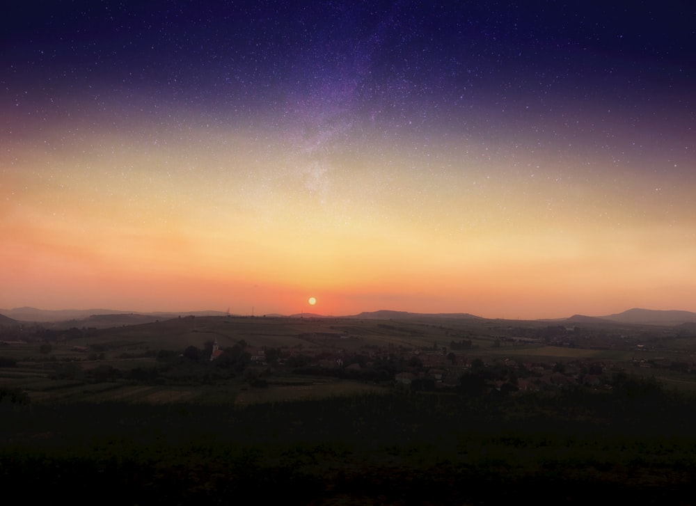 green mountain during sunset