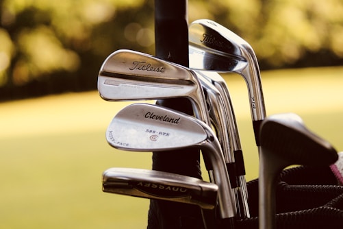 SAAG image of gray steel golf clubs on selective focus photo