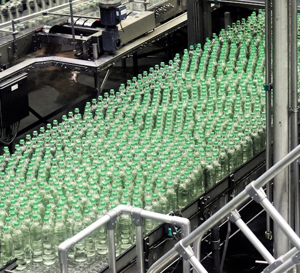 glass bottles on top of gray machine