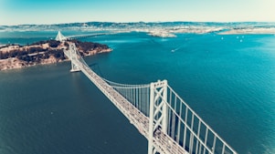 white bridge over body of water