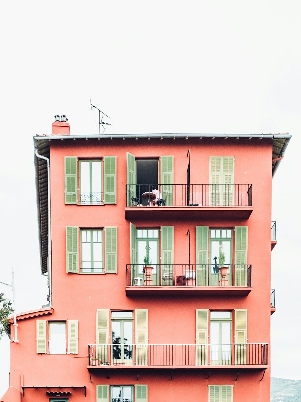 orange and green 4-storey building