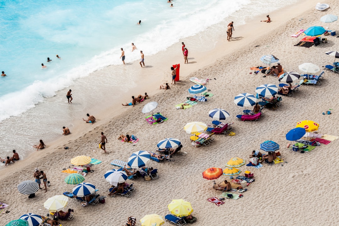 aerial view of parasols and people near beach, Egremni (Lefkada)